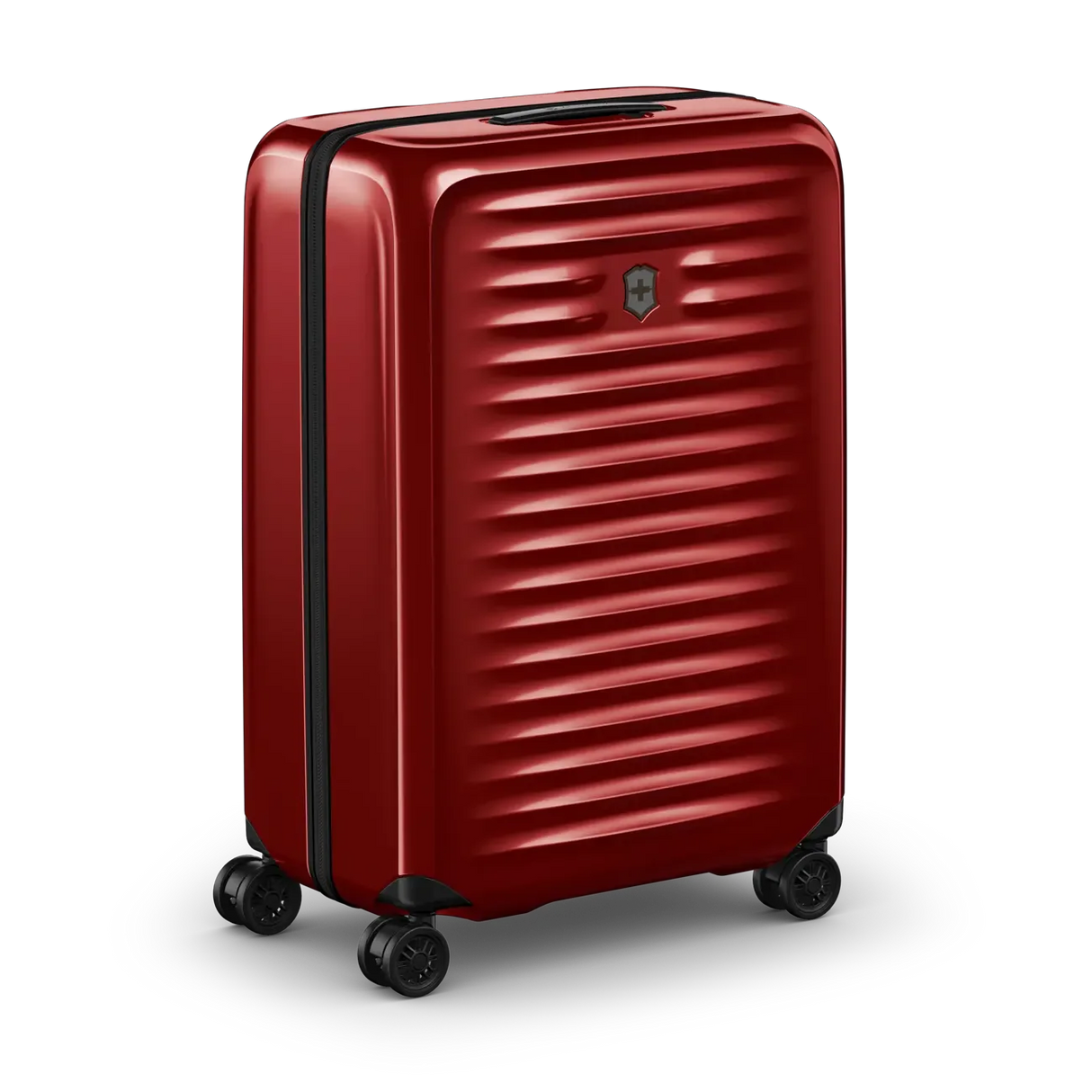 Red hardshell rolling suitcase with horizontal ridges and wheels.