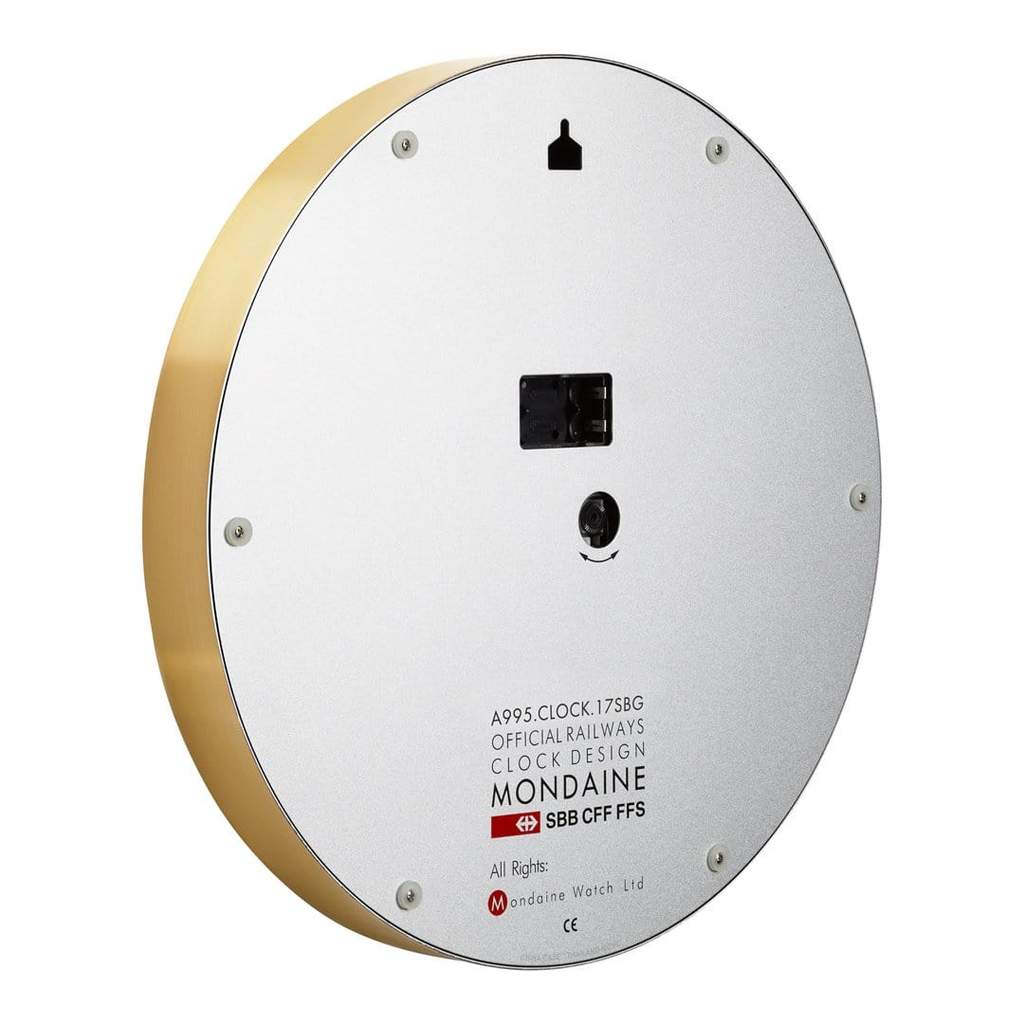 Circular wall clock with a white face and gold rim.