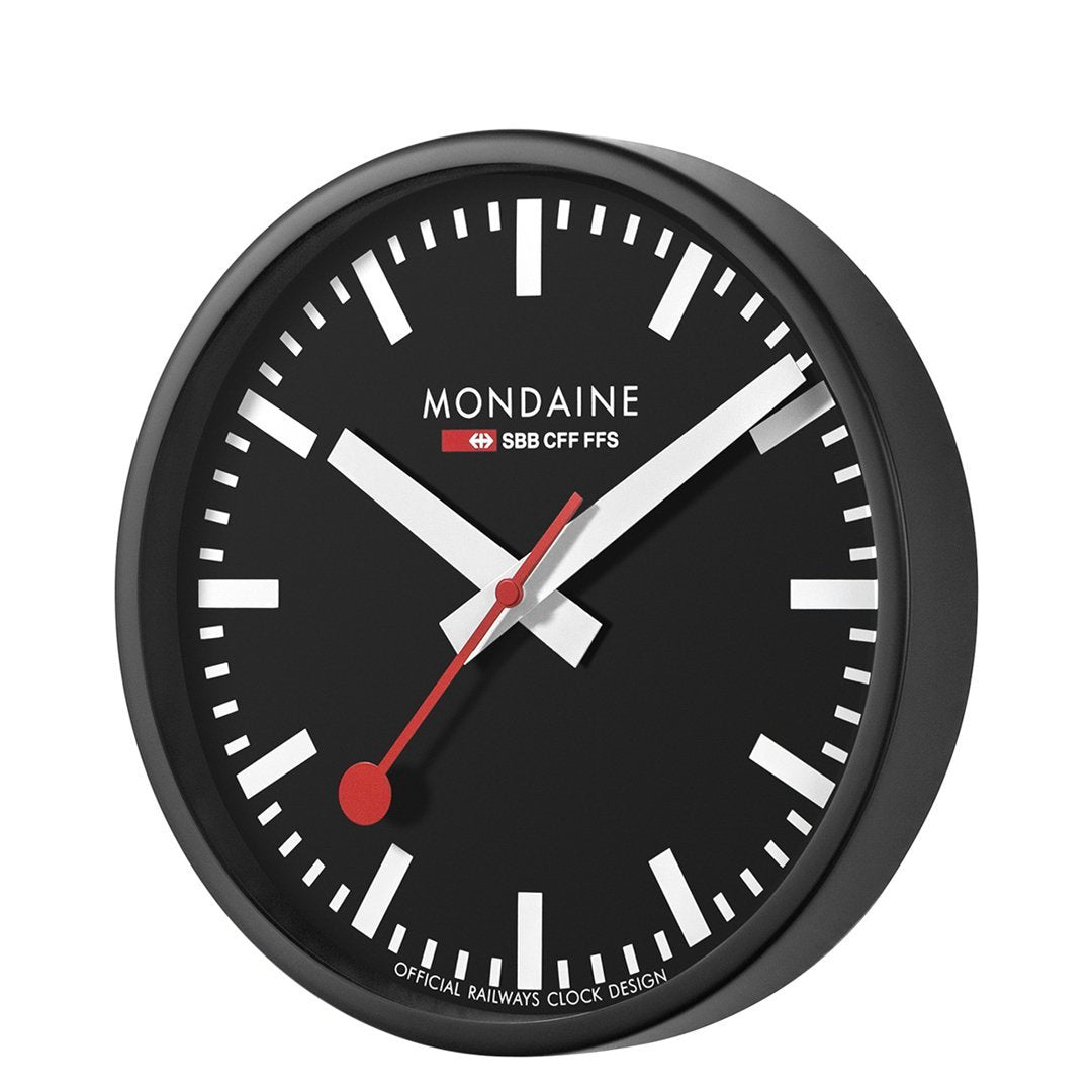 Classic Swiss railway-style wall clock with a black face and white markings.