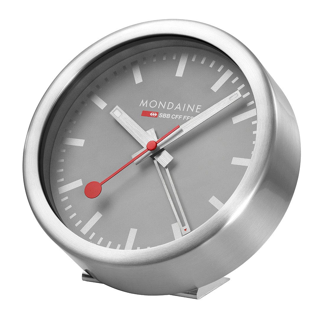Sleek, modern analog alarm clock with a gray face and red hands.