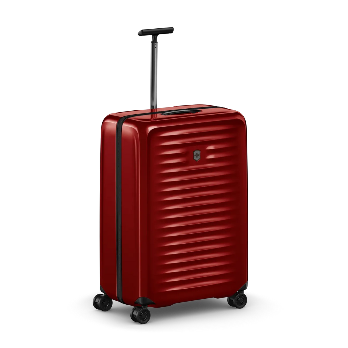 Red hardshell rolling suitcase with horizontal ridges and a retractable handle.