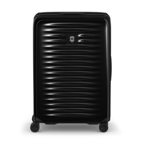 Black hardshell rolling suitcase with horizontal ridges and a Swiss Army logo.
