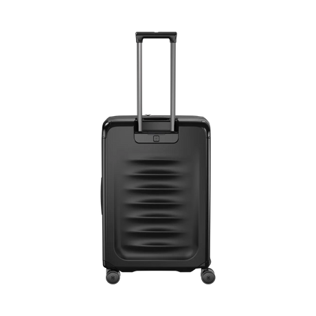 Black hardshell rolling suitcase with a retractable handle and horizontal ridges on the front.