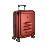 Red hardshell rolling suitcase with a retractable handle and spinner wheels.