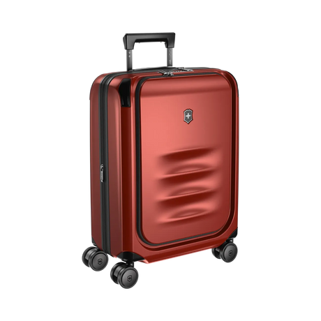 Red hardshell rolling suitcase with a retractable handle and spinner wheels.