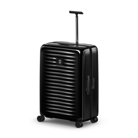 Black hard-shell rolling suitcase with horizontal ridges and an extendable handle.