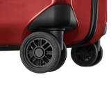 Wheels of a red suitcase or luggage.