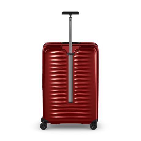 Red hardshell rolling suitcase with horizontal ridges and an extendable handle.