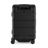 Black hardshell suitcase with wheels and a retractable handle.