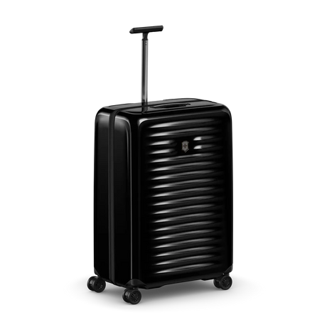 Black hardshell rolling suitcase with horizontal ridges and an extendable handle.