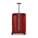 Red hardshell rolling suitcase with horizontal ridges and an extendable handle.