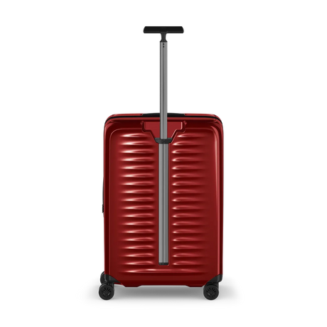 Red hardshell rolling suitcase with horizontal ridges and an extendable handle.