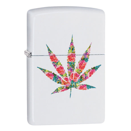 Zippo lighter with a colorful floral marijuana leaf design on a white background.