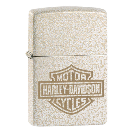 Zippo lighter with a Harley-Davidson logo engraved on its textured metallic surface.