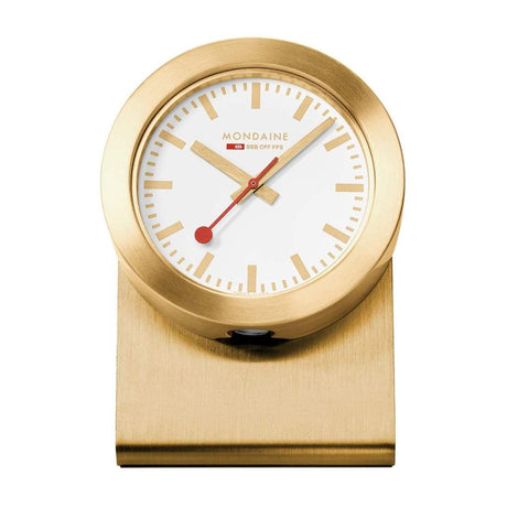 Gold-colored desk clock with a white face and red hands.