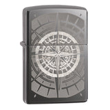 Zippo lighter with an engraved compass rose design on its surface.