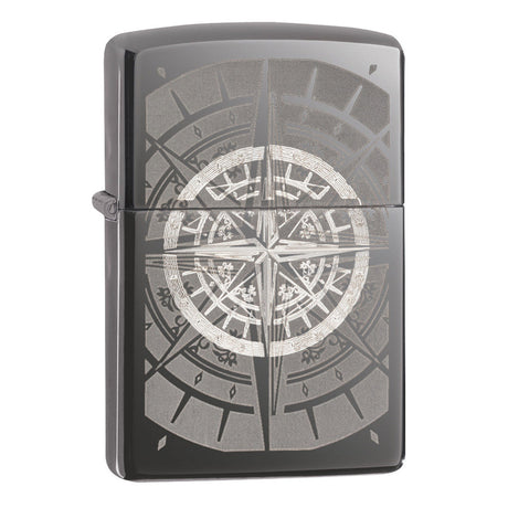 Zippo lighter with an engraved compass rose design on its surface.