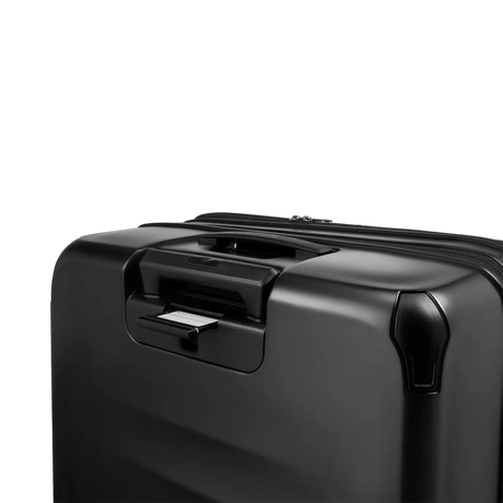 Black hardshell suitcase with a retractable handle.
