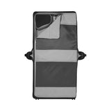 Folding travel cot or portable playpen with striped fabric panels.