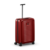 Red hardshell rolling suitcase with horizontal ridges and an extendable handle.