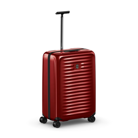 Red hardshell rolling suitcase with horizontal ridges and an extendable handle.