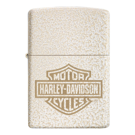 Zippo lighter with a Harley-Davidson logo engraved on a textured cream-colored surface.