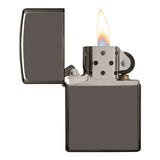Metal cigarette lighter with an open lid and lit flame.