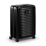 Black hardshell rolling suitcase with horizontal ridges and wheels.
