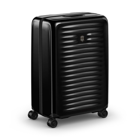 Black hardshell rolling suitcase with horizontal ridges and wheels.