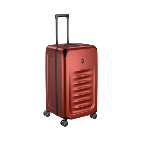 Red hardshell rolling suitcase with a textured front panel and retractable handle.