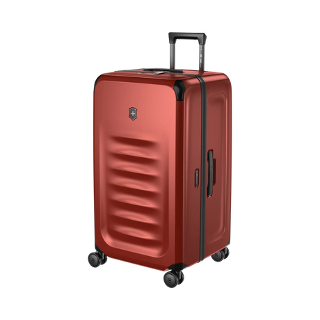 Red hardshell rolling suitcase with horizontal ridges and a retractable handle.