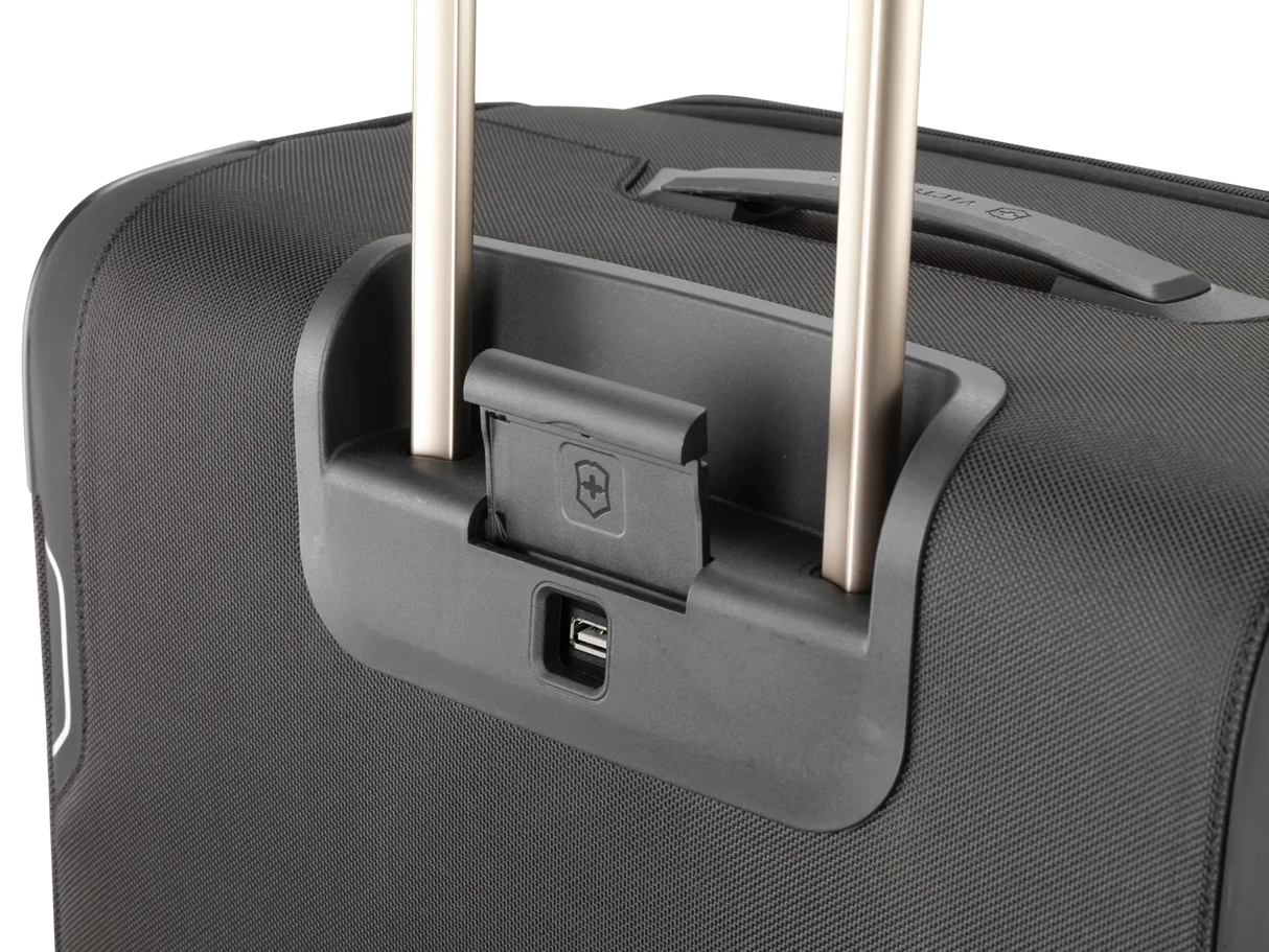 Wheeled suitcase with extendable handle and USB port.