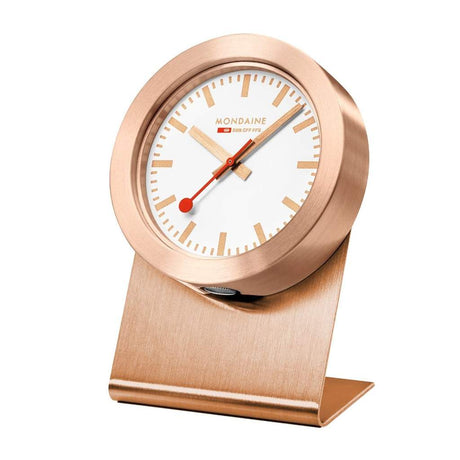 Rose gold desk clock with a white face and red second hand.