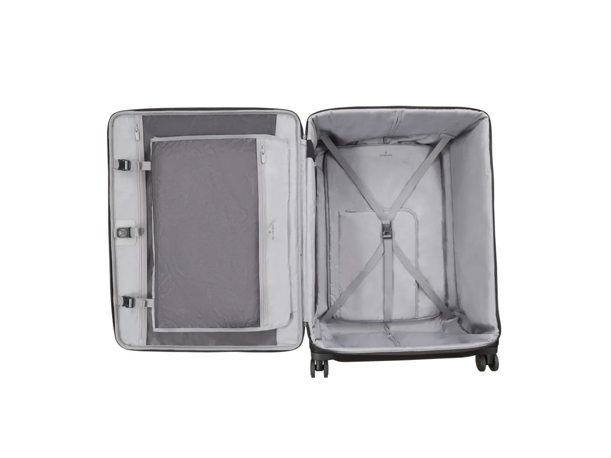 Open suitcase with interior compartments and mesh divider.