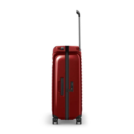 Red hardshell rolling suitcase with an extendable handle and wheels.