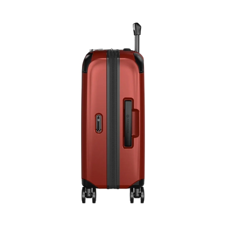 Red hardshell rolling suitcase with black trim and wheels.