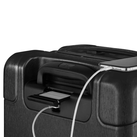 Black suitcase with a built-in USB charging port.