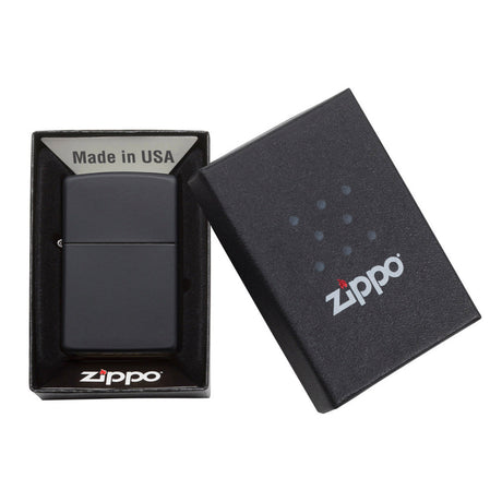 Matte black Zippo lighter in its packaging box.
