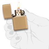 Gold-colored Zippo lighter with a lit flame.