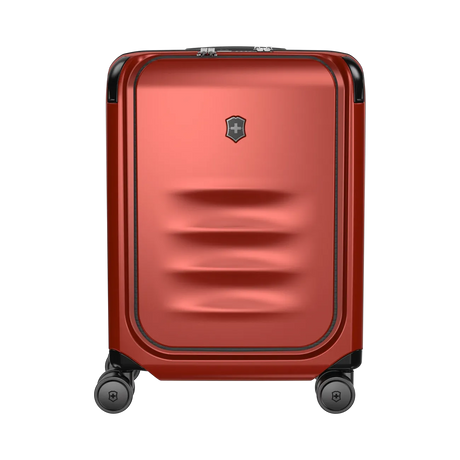 Red hardshell rolling suitcase with horizontal ridges on the front panel.