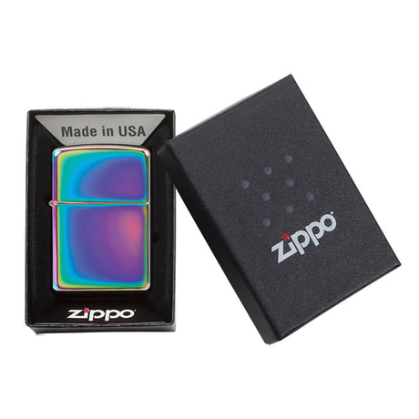 Iridescent Zippo lighter with its packaging box.