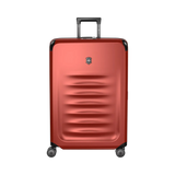 Red hardshell rolling suitcase with horizontal ridges and a retractable handle.