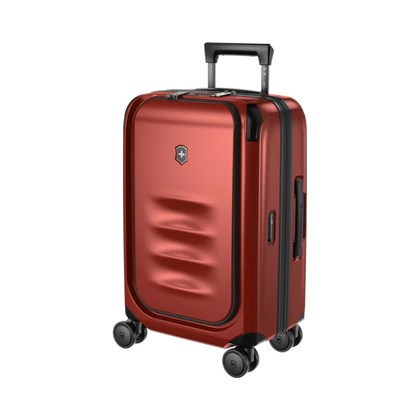 Red hardshell rolling suitcase with a retractable handle and wheels.