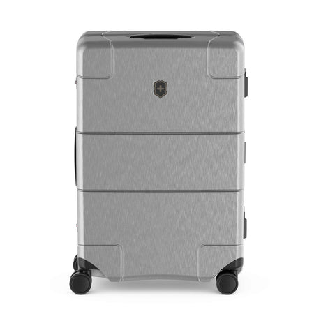 Gray hardshell rolling suitcase with multiple compartments and a logo emblem.