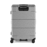 Silver hardshell rolling suitcase with multiple compartments and a retractable handle.