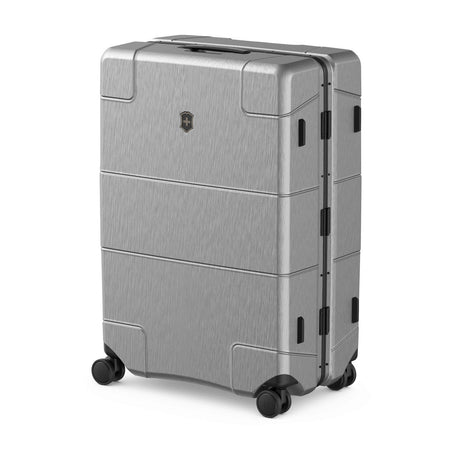 Silver hardshell suitcase with wheels and a segmented design.