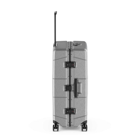 Hard-shell rolling suitcase with horizontal ridges and a telescoping handle.