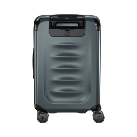 Gray hardshell rolling suitcase with horizontal ridges on the front panel.