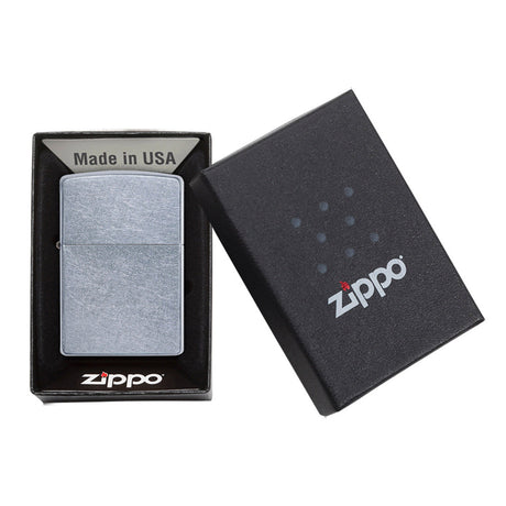 Zippo lighter in its packaging, displaying the product and its box.