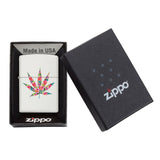 Zippo lighter with a colorful marijuana leaf design on its case, displayed in its packaging.